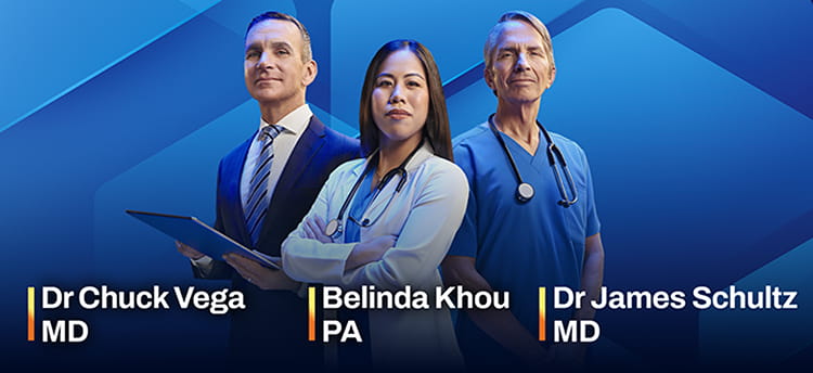 Three healthcare professionals in medical attire stand in front of a blue Cologuard backdrop.